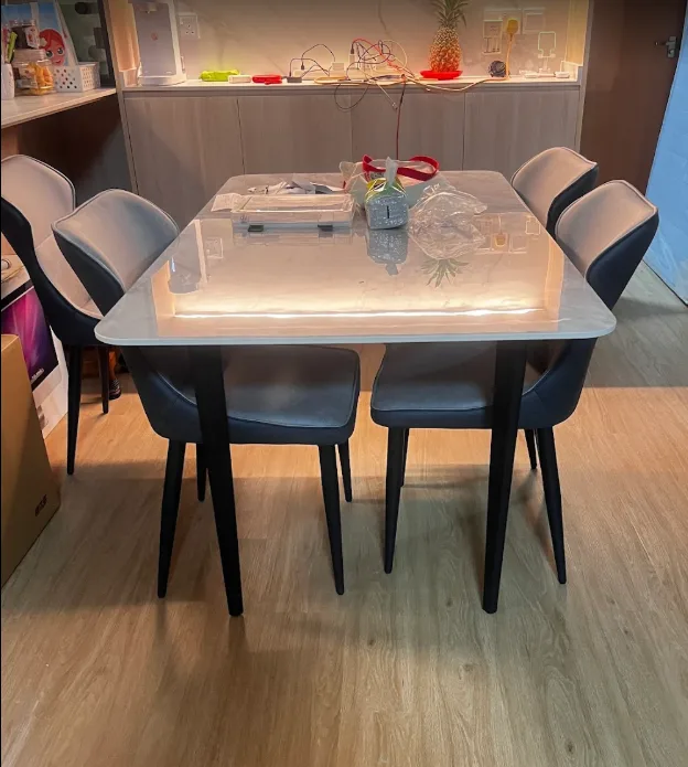 Newly delivered Megahome dining table and chairs in a customer's home