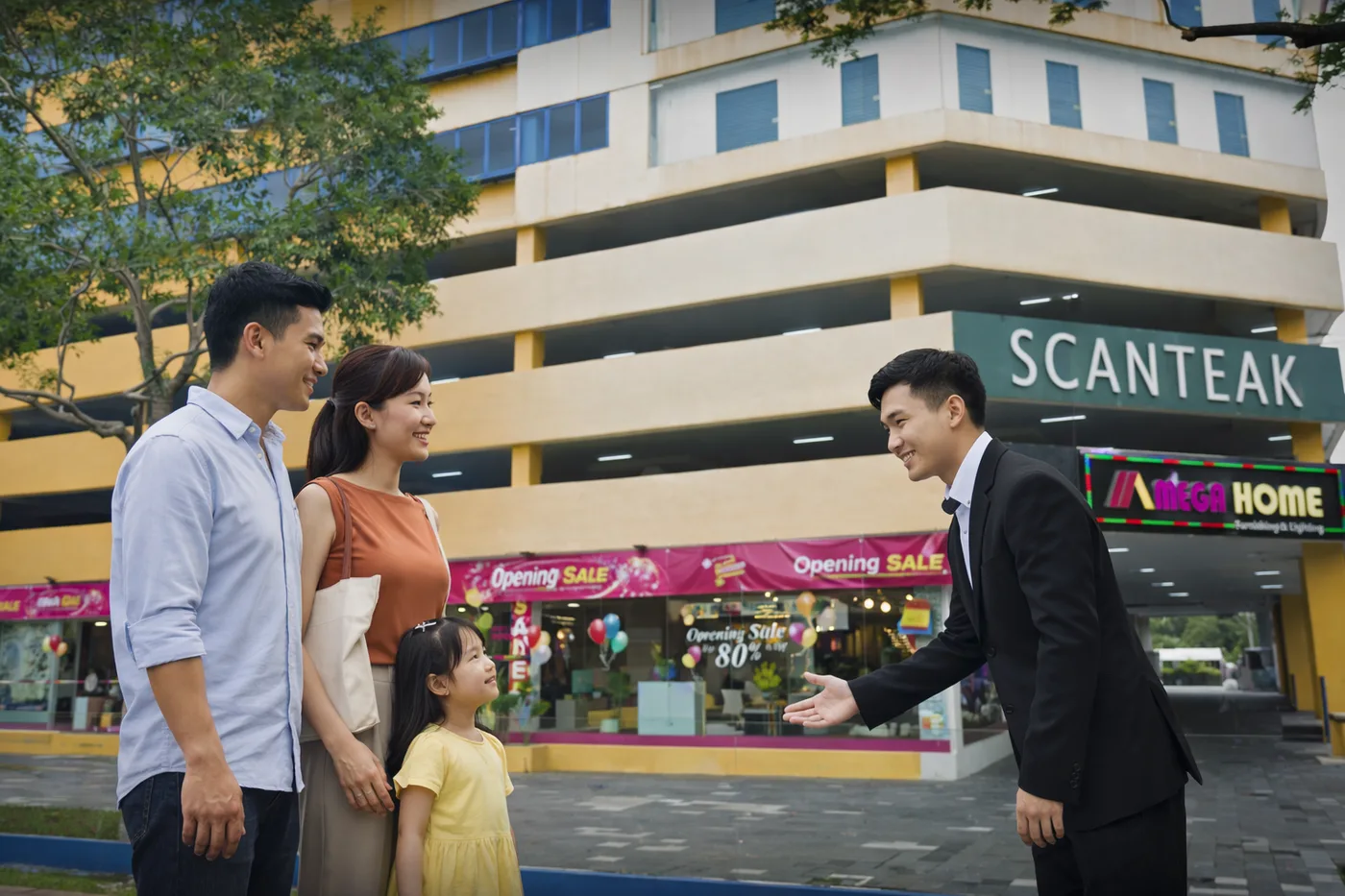 Megahome team welcoming a customer outside the Toa Payoh showroom